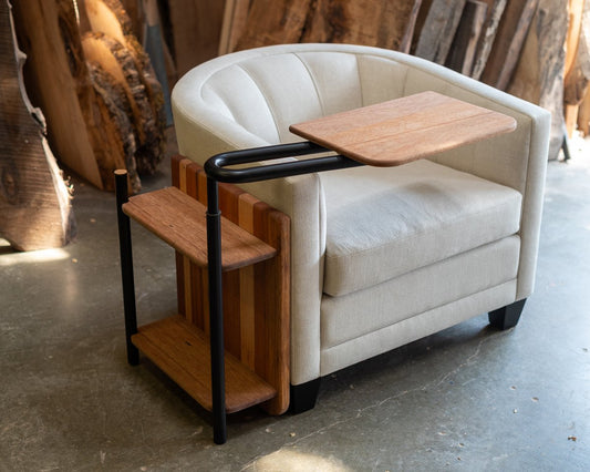 The Corbel Side Table next to a white lounge chair