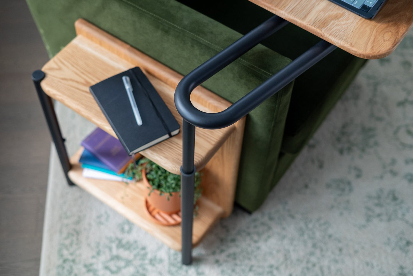 Closeup of the rotating arm of the Corbel Adjustable Side Table.