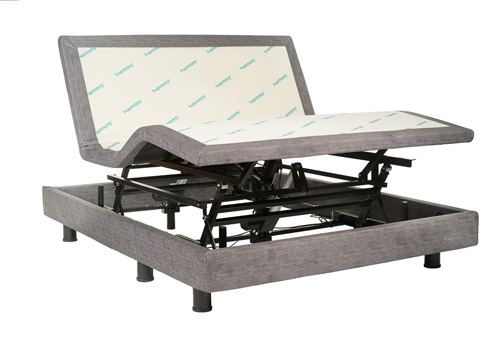 Gray adjustable bed base without a mattress on a white background