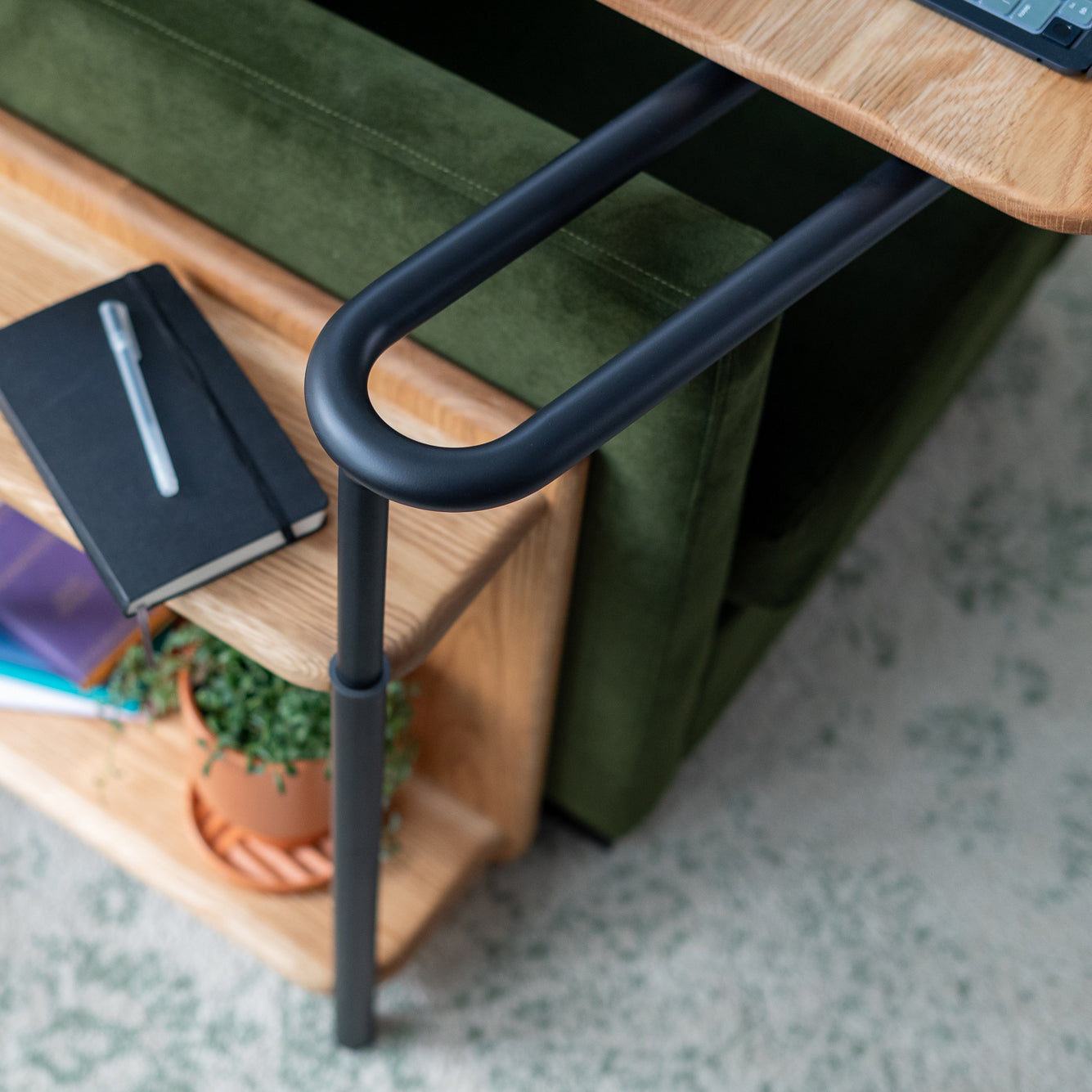 Closeup of the rotating arm of the Corbel Adjustable Side Table.