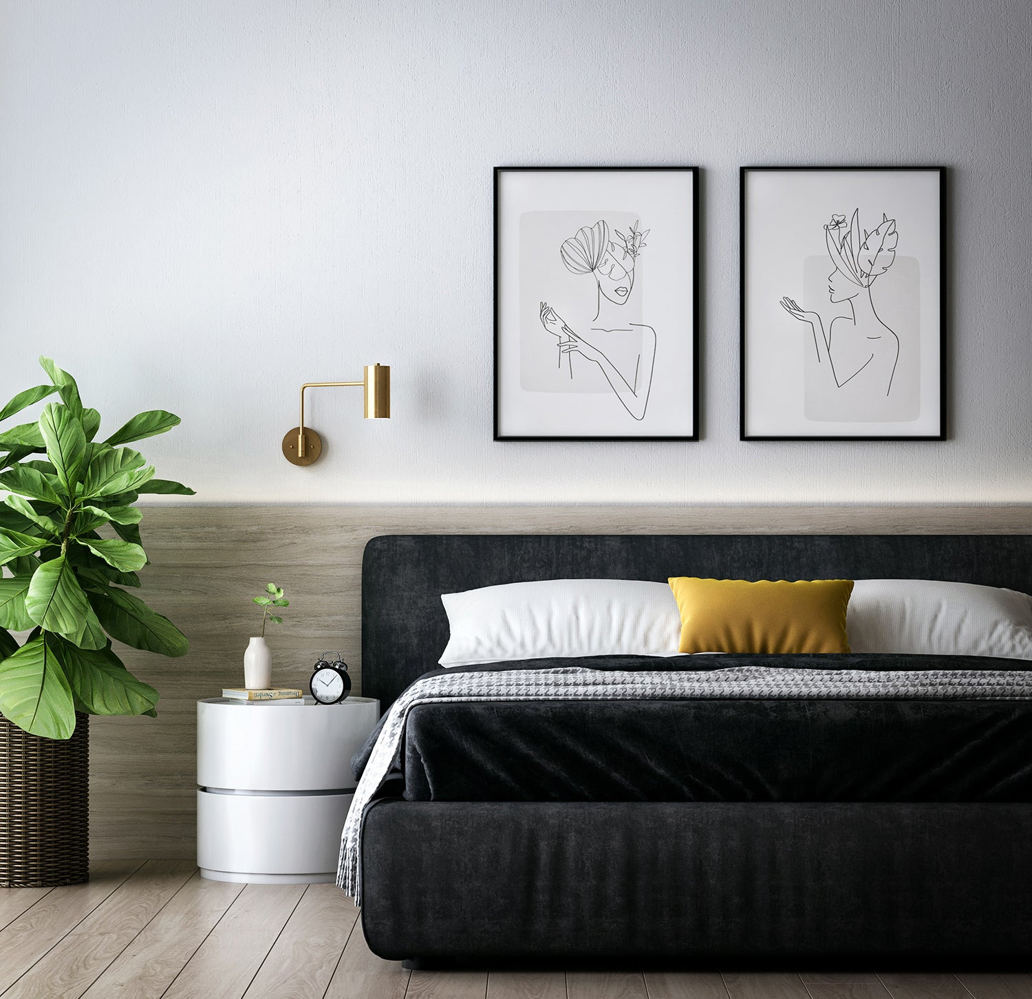 A modern bedroom with a dark bed frame, white bedside table, a fern, and two framed drawings above the bed.