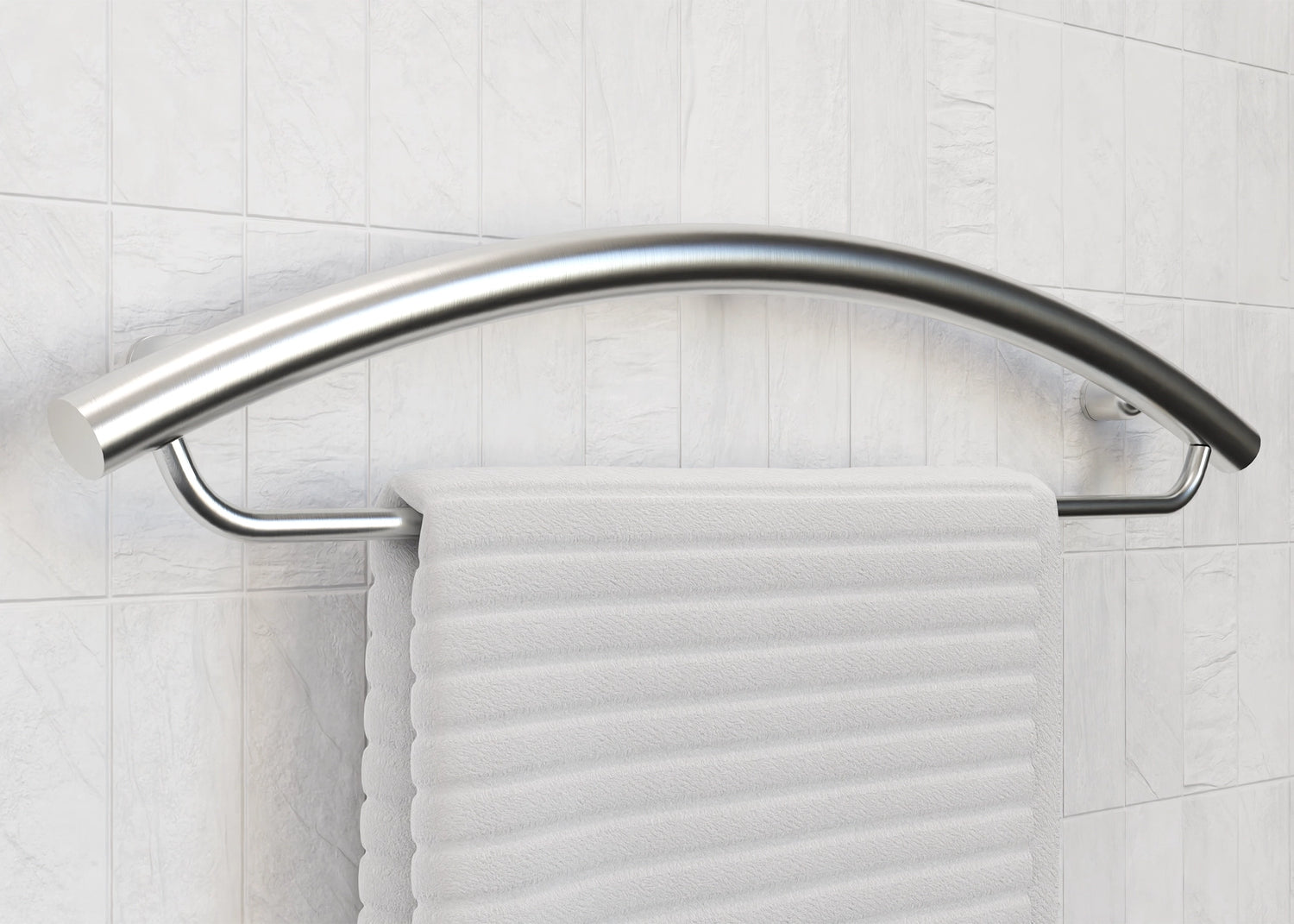 Silver towel holder and grab bar holding a white towel on a white tile background