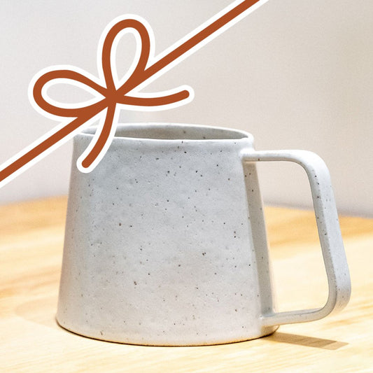 Home Stability Mug with a Bow Overtop of It