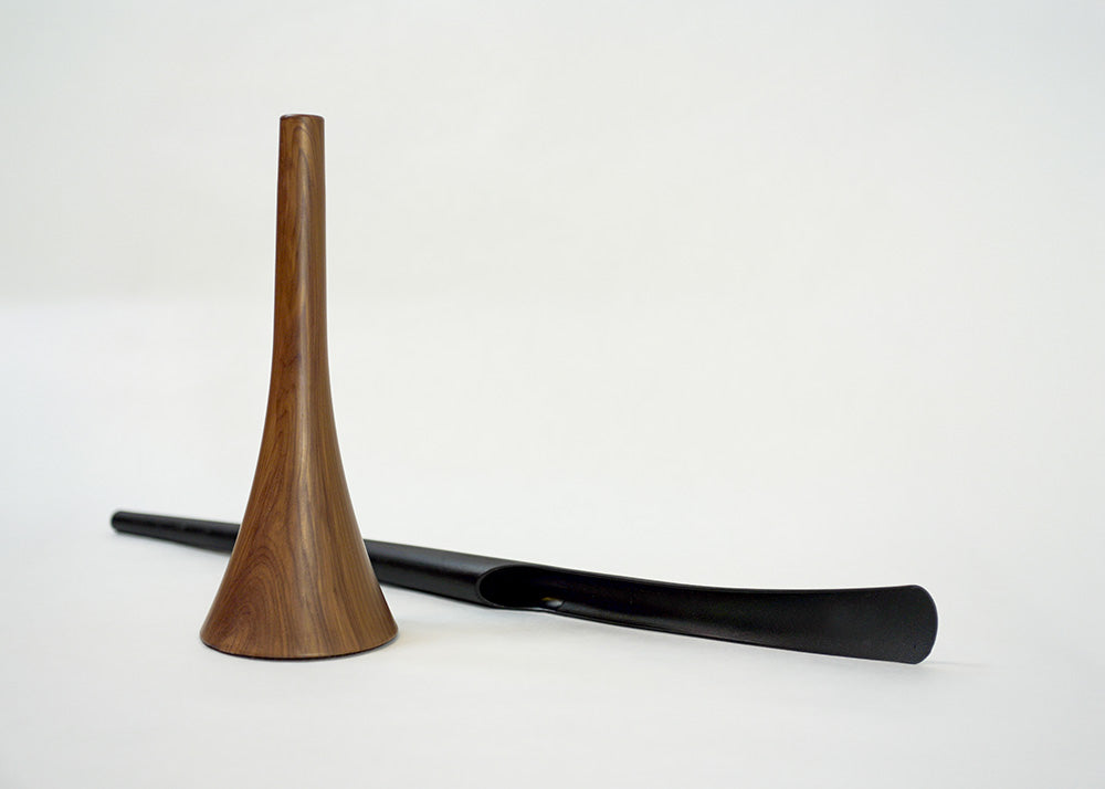 shoehorn base with a black shoehorn lying beside it